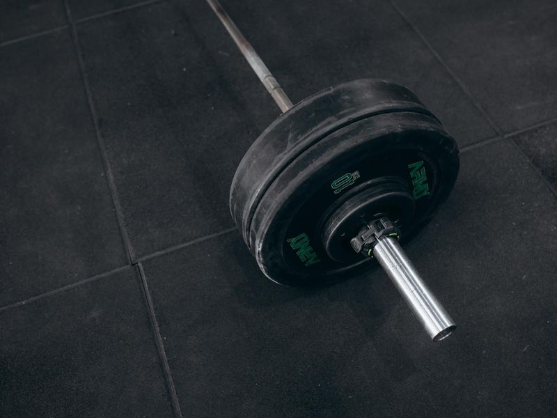 Black and white shot of a heavy kettlebell on floor.